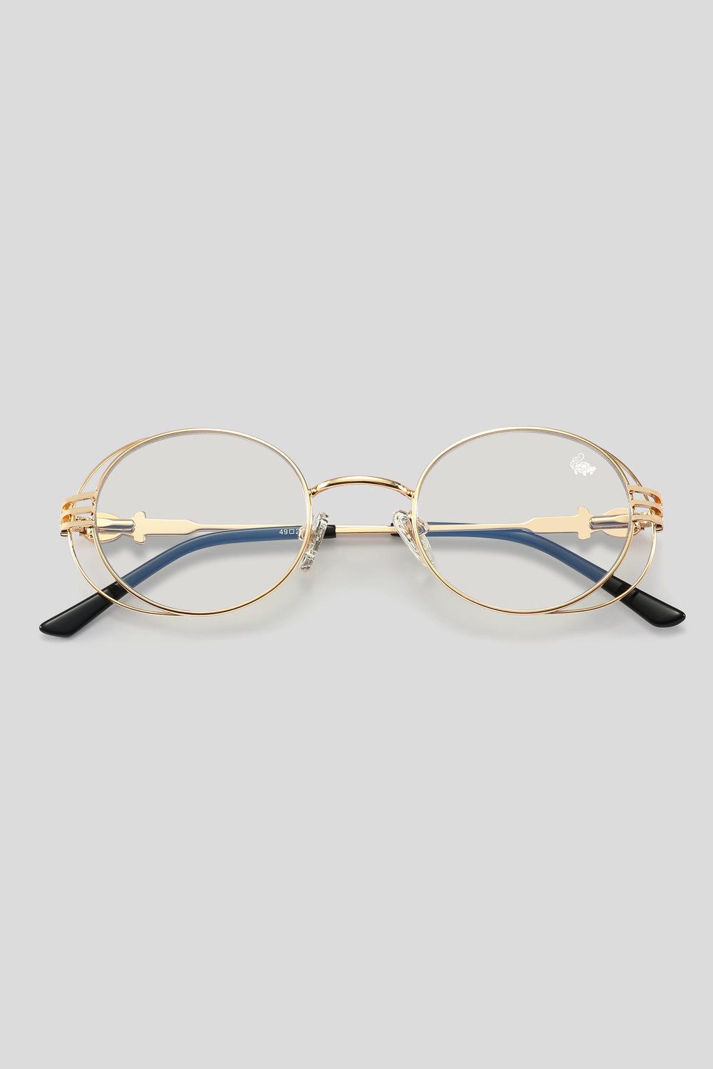 Gold-framed eyeglasses with blue lenses on a light gray background. 2pac glasses