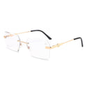 A pair of rimless, gold-colored eyeglasses with a stainless steel frame and black temples.